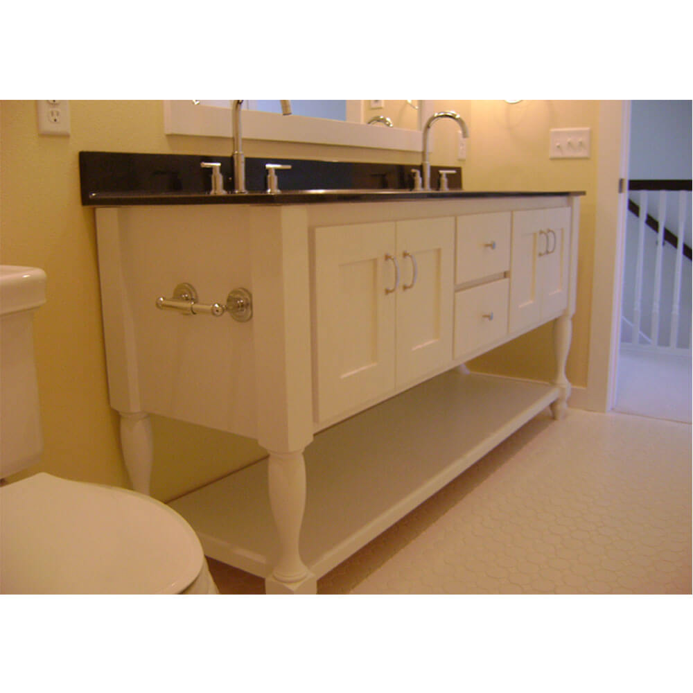 White bathroom sink with ornate legs