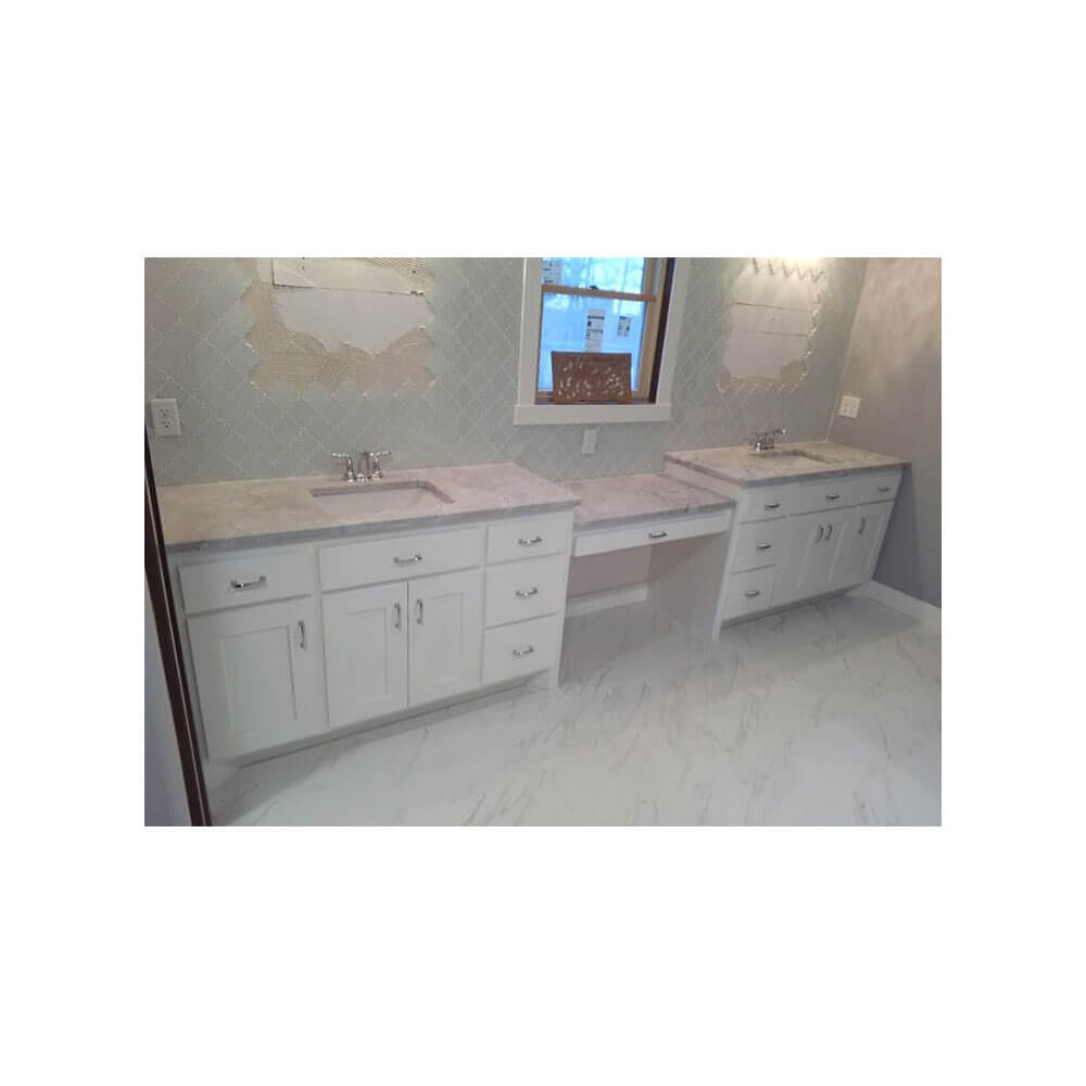 White cabinets with a gray granite countertop