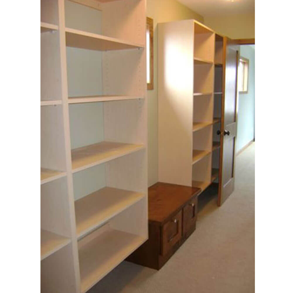 Wooden shelves hung on a wall in a closet