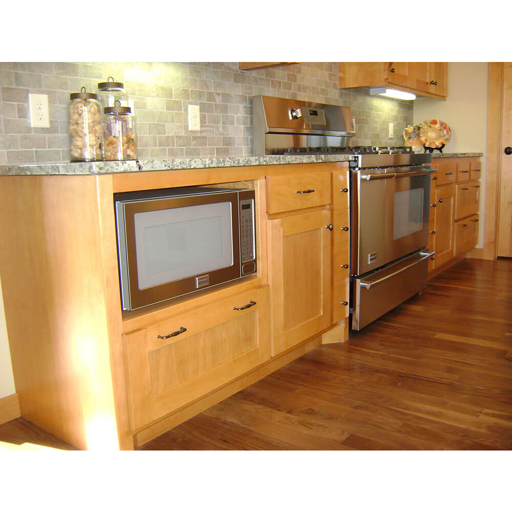 Light colored wooden kitchen cabinets